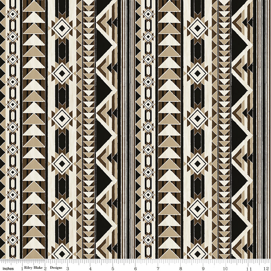 A repeating geometric pattern featuring vertical bands of triangles, diamonds, and stripes in black, beige, and white with ruler for scale.