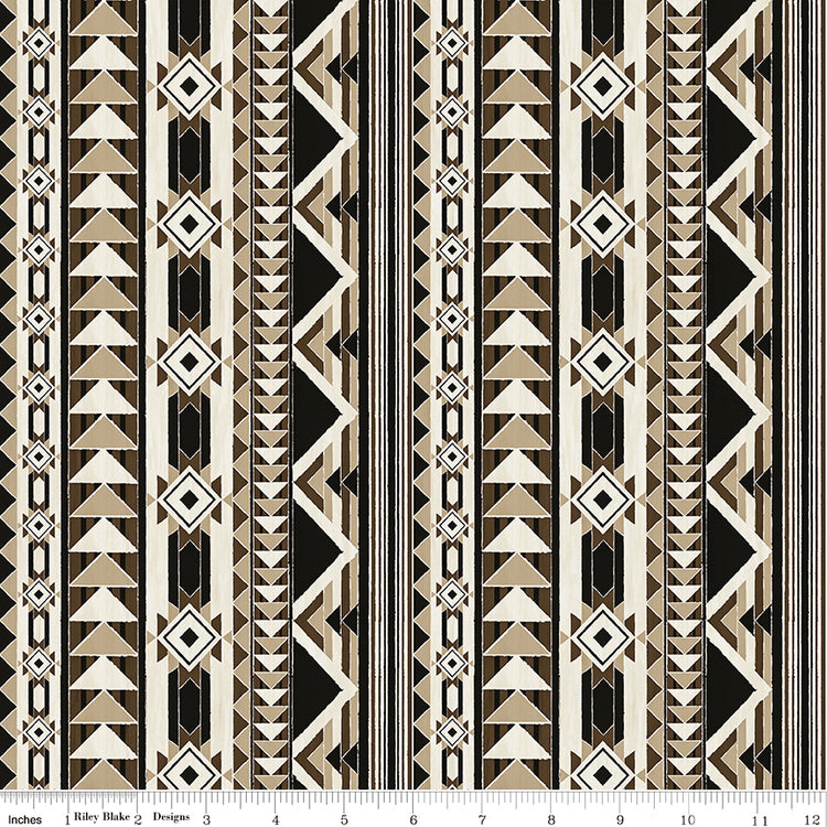 A repeating geometric pattern featuring vertical bands of triangles, diamonds, and stripes in black, beige, and white with ruler for scale.