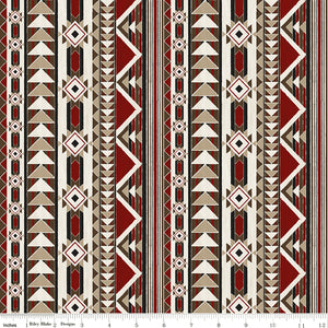 A repeating geometric pattern with vertical bands of triangles, diamonds, and zigzags in red, beige, brown, black, and off-white with ruler for scale.