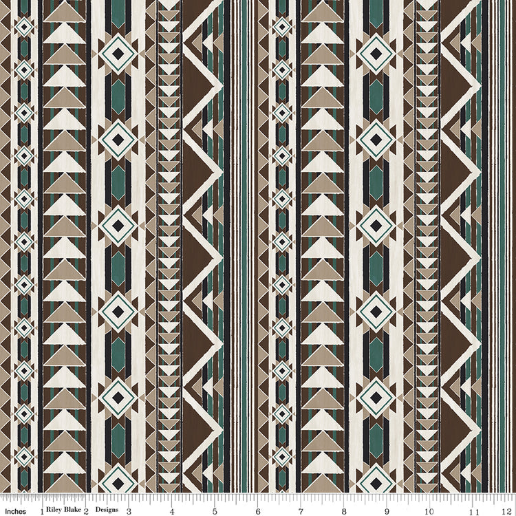 A repeating geometric pattern with vertical stripes featuring triangles, diamonds, and zigzags in brown, beige, white, and teal with ruler for scale.