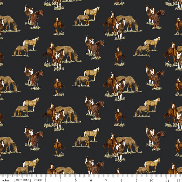 A repeating pattern of horses and poncho riders in brown, tan, cream, and white tones on a dark charcoal background with ruler for scale.
