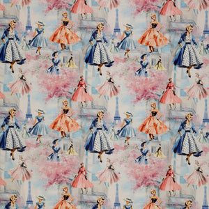 En Vogue Fabric Collection - Sophistication: Vintage-style illustrated women in pink and blue dresses, pink cherry blossom trees, and small Eiffel Tower silhouettes on a pale blue background CL64250102-01