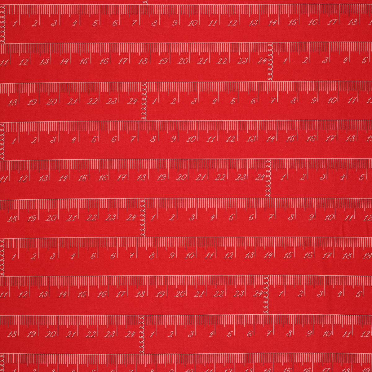 En Vogue Fabric Collection - Chic Rulers Coral: red coral fabric with a repeating pattern of white printed rulers showing inch and centimeter measurements CL64250107-01