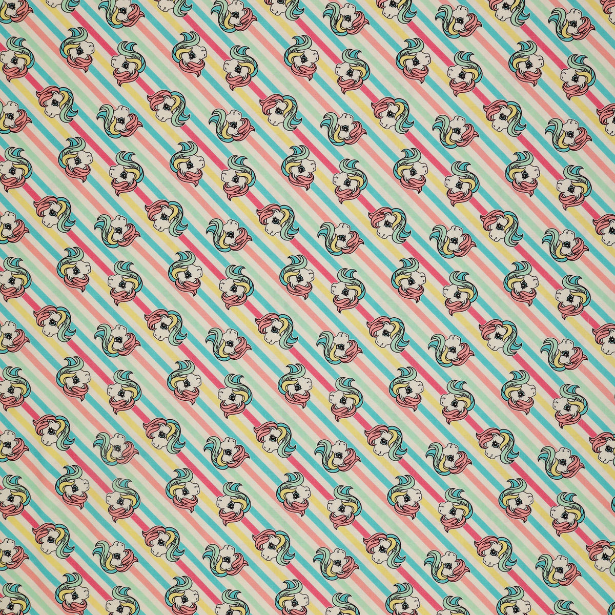 My Little Pony Retro Fabric Collection - Pony Stripe: cartoon pony faces, set against a background of diagonal pastel stripes in blue, pink, and white CL95010204-01
