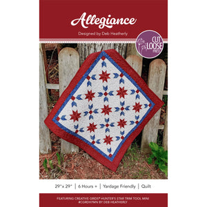 Allegiance quilt pattern cover showing finished red, white and blue star wall hanging on a fence