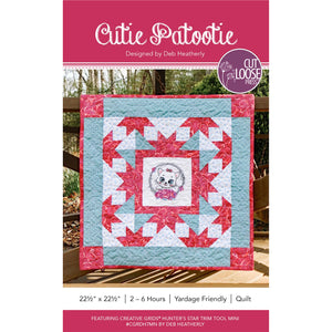 Cutie Patootie quilt pattern cover showing finished wall hanging with kitten center and Hunter's Star border