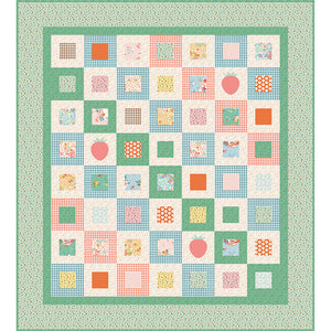 Cotton Nook quilt featuring colorful patchwork squares, gingham, florals, dots and apple motifs.