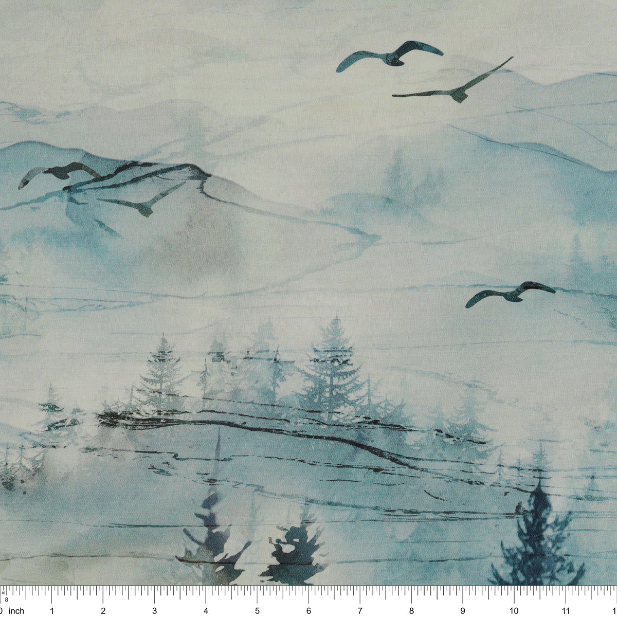 Altitude Fabric Collection - Ombre Watercolor mountain fabric with misty blue hills, evergreen trees, and flying birds NCDP29154-43 with ruler for size