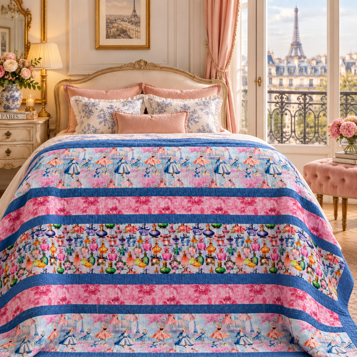 A colorful quilted comforter with pink and blue stripes and floral patterns is styled on a bed in a luxurious bedroom with a view of the Eiffel Tower.