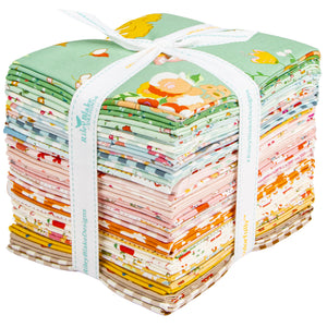 Cotton Nook Fat Quarter Bundle tied with white ribbon, topped with mint floral fabric.