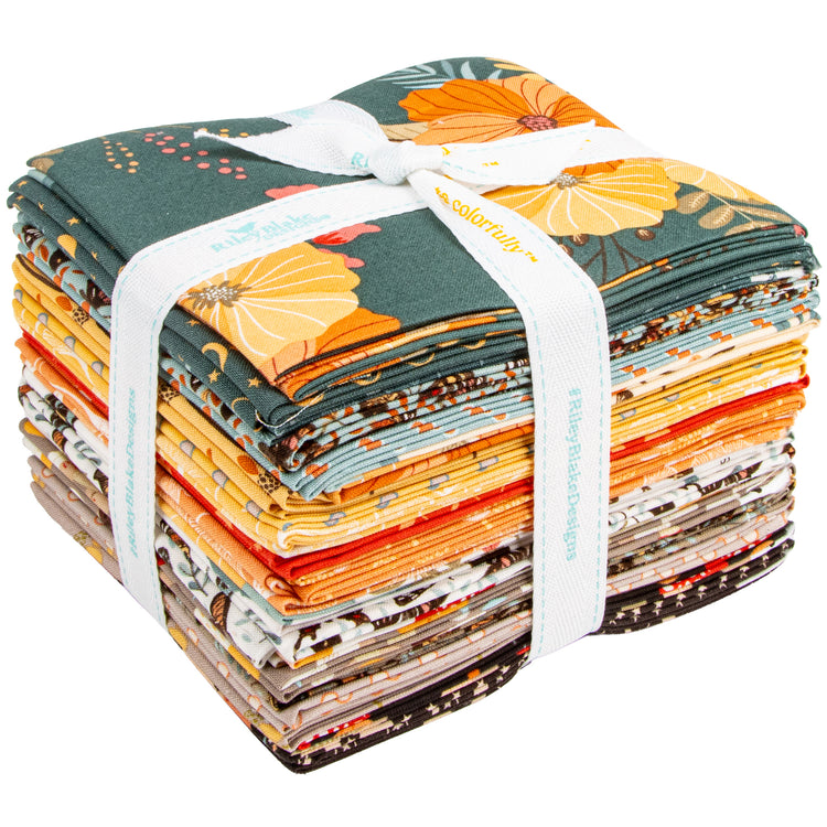 A stack of folded fabric pieces tied with a white ribbon, featuring a multicolor autumn floral pattern with orange, yellow, brown, and teal tones. The brand name 'salty truth' is visible on the ribbon.