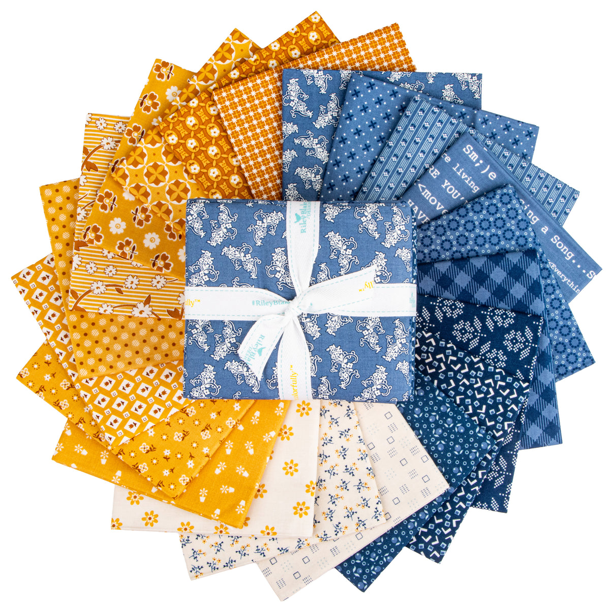 Fabric squares arranged in a circular fan, featuring various patterns and colors including yellow, orange, blue, and cream, with a central blue patterned fabric square tied in a white ribbon bow.