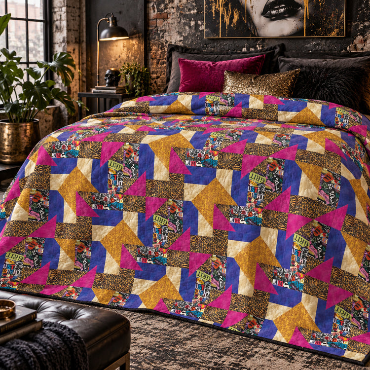 Grunge Gone Glam quilt with gold, magenta and blue patchwork on a bed in a moody industrial bedroom.