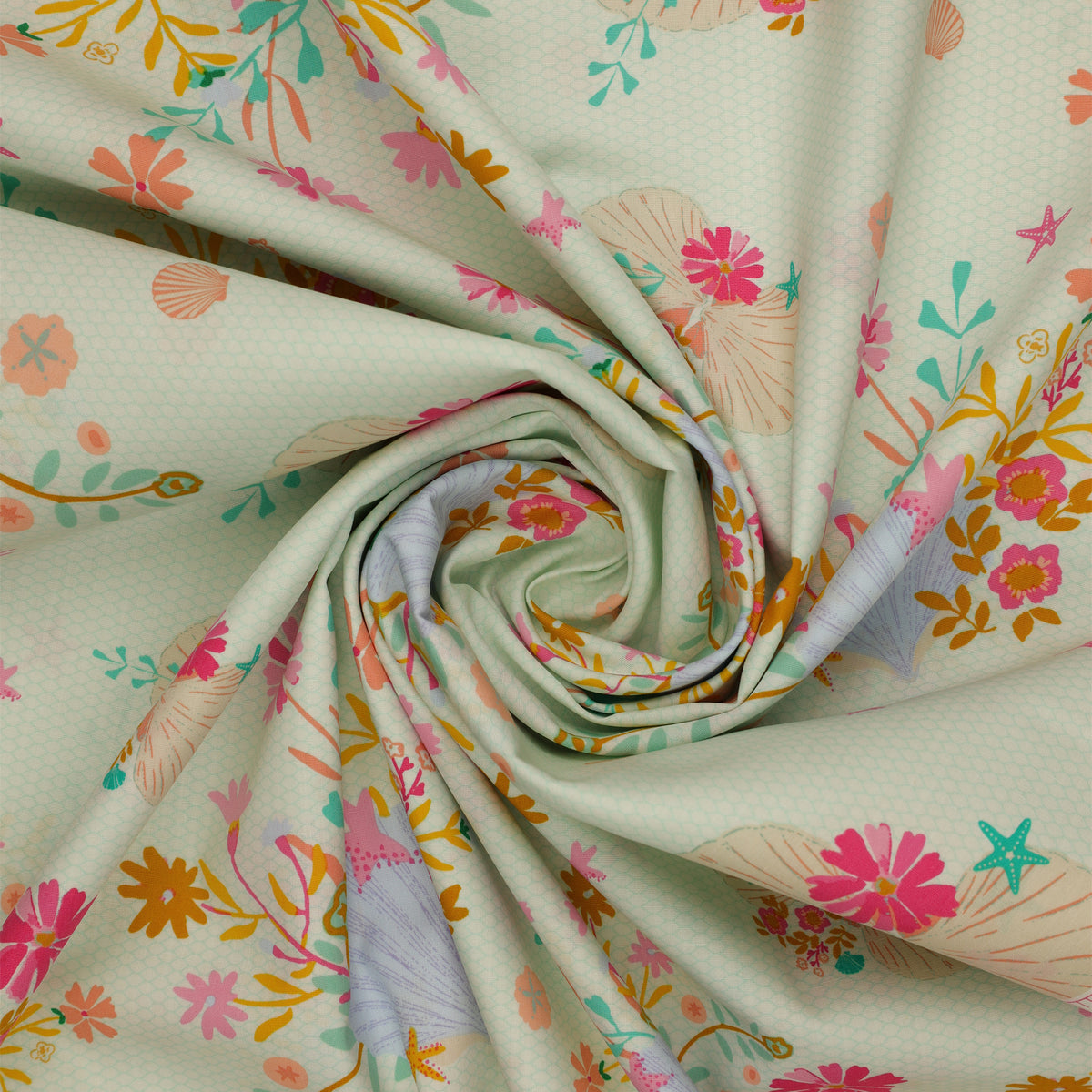 Island Life Seaflower Blossom fabric with seashells, starfish, and colorful flowers on cream swirled to show texture.
