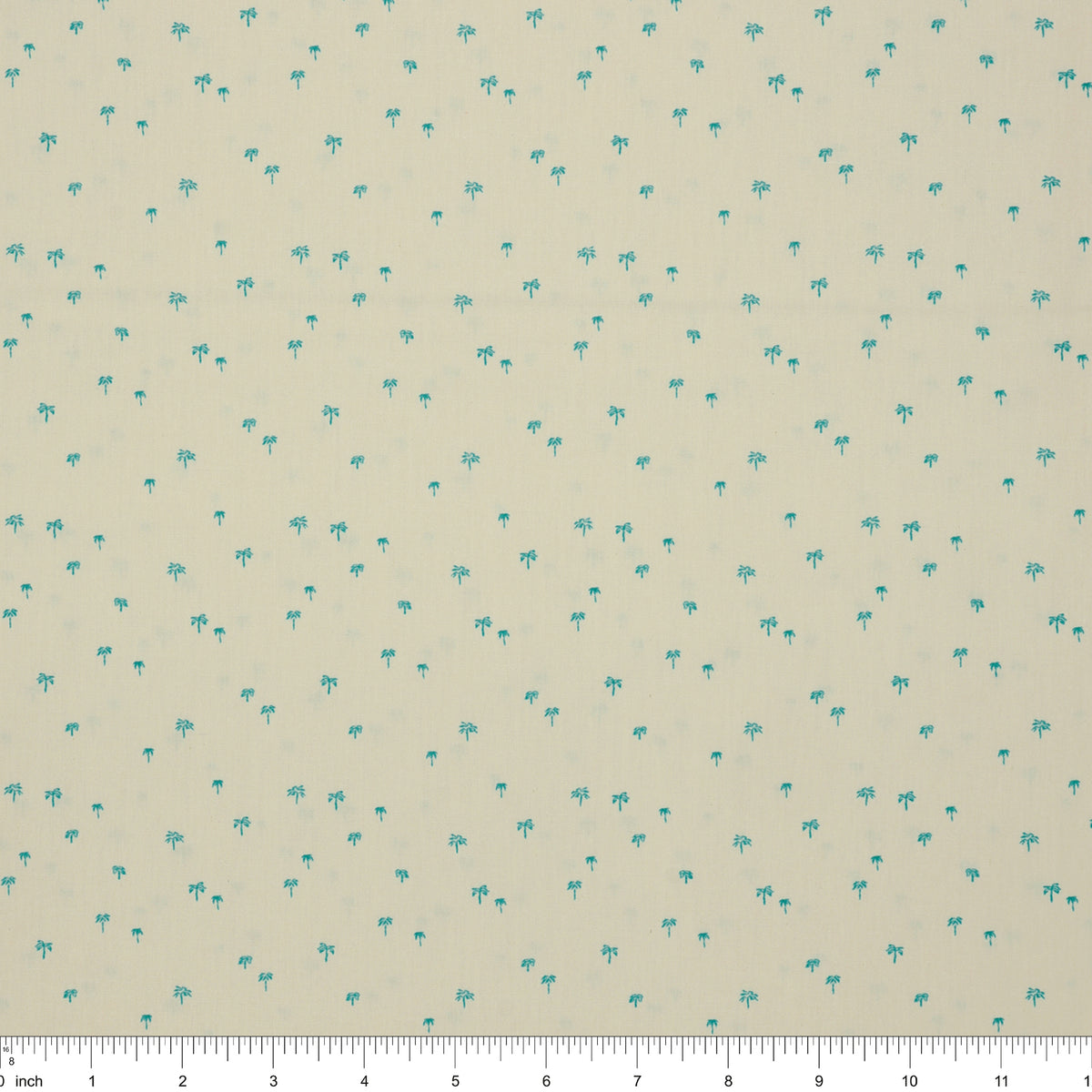Island Life Tropic Breeze fabric with tiny turquoise palm trees scattered on a soft cream background with ruler for scale.