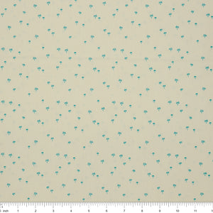Island Life Tropic Breeze fabric with tiny turquoise palm trees scattered on a soft cream background with ruler for scale.