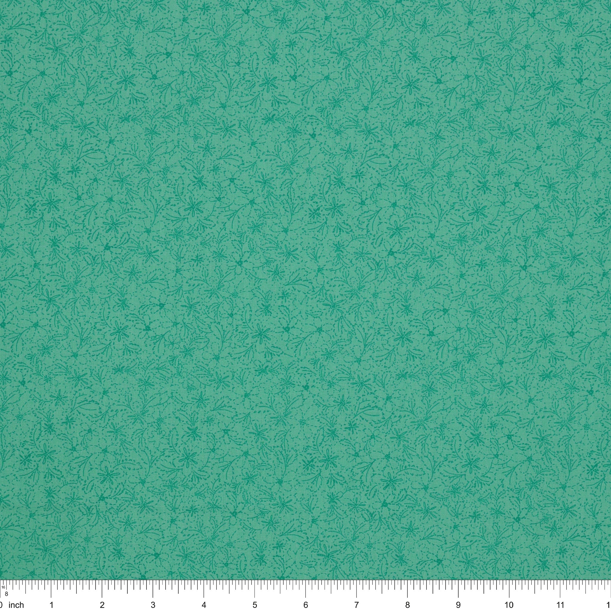 Island Life Tide Petal fabric with a subtle tonal floral pattern in layered turquoise with ruler for scale.