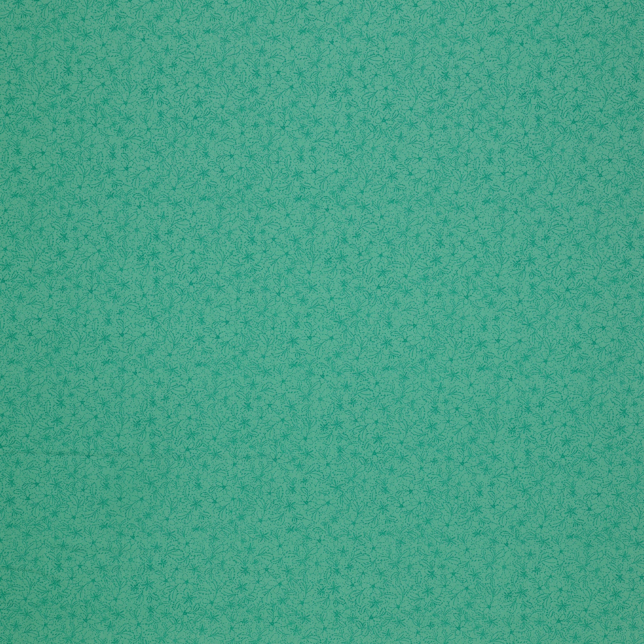 Island Life Tide Petal fabric with a subtle tonal floral pattern in layered turquoise.