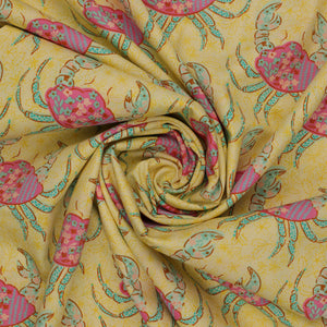 Island Life Tidal Stroll fabric with floral pink crabs and aqua accents on a warm cream background swirled showing texture.