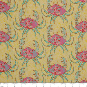 Island Life Tidal Stroll fabric with floral pink crabs and aqua accents on a warm cream background with ruler for scale.