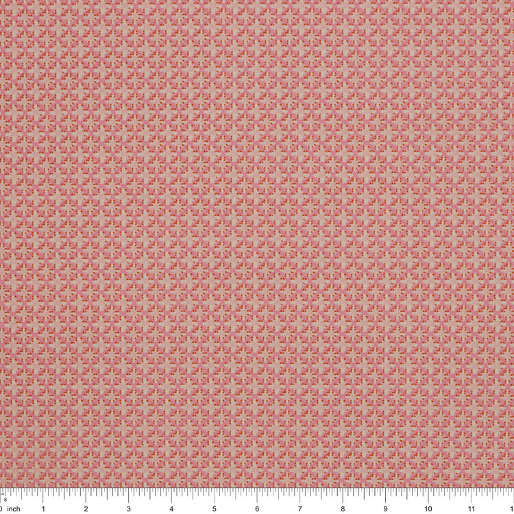 Island Life Summer Rattan fabric with a small woven-inspired geometric pattern in pink and coral with ruler for scale.