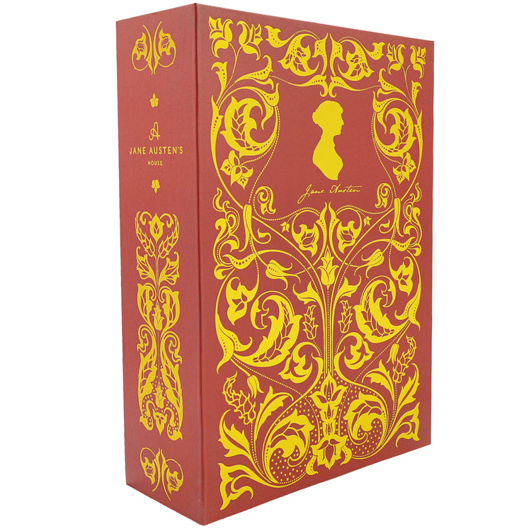 A Jane Austen's Books hardcover book box set featuring a red dust jacket with ornate gold Art Nouveau illustrations and a gold silhouette of Jane Austen on the front, with the spine visible showing the title and author.