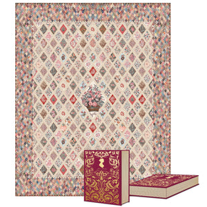 A large decorative book box featuring an intricate patchwork-style diamond pattern in soft pink, beige, blue, and brown tones, with two matching ornate books placed in front on a white background.