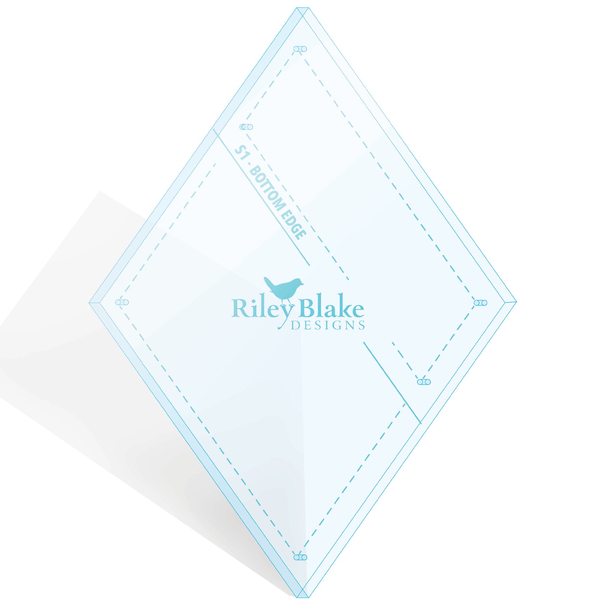 A clear acrylic plate with a light blue border, featuring printed blue measurement markings, dashed guide lines, and the Riley Blake Designs logo in the center, shown on a white background with a soft shadow.