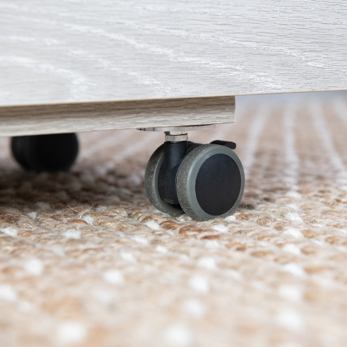 Close-up of the locking caster wheel on the Koala Serger Studio cabinet base