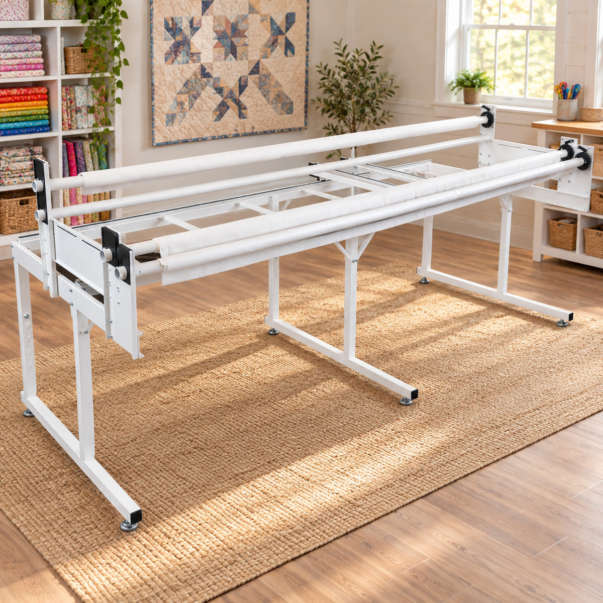 Loft quilting frame, set up on a woven jute rug in a bright, wood-floored craft room.