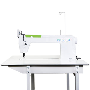 A Moxie ST side profile mounted on a white work table with metal legs, shown against a plain white background.