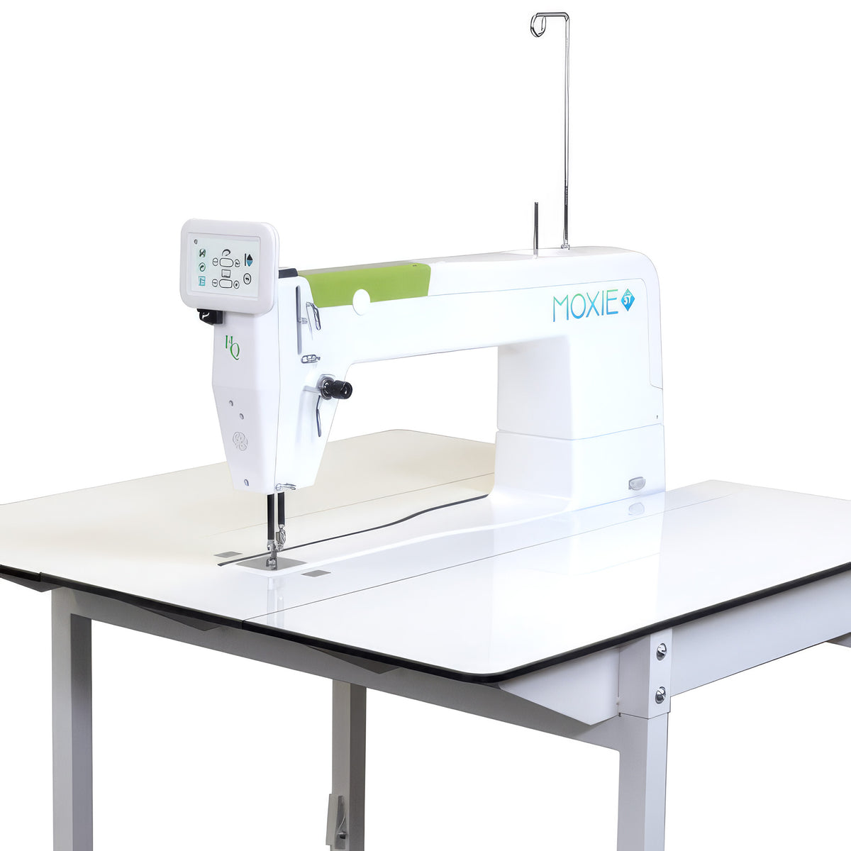 A white Moxie ST sewing machine mounted on a white table, shown against a plain white background.