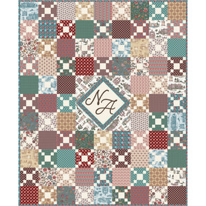 Northanger Abbey quilt with colorful patchwork blocks and a central NA monogram medallion.