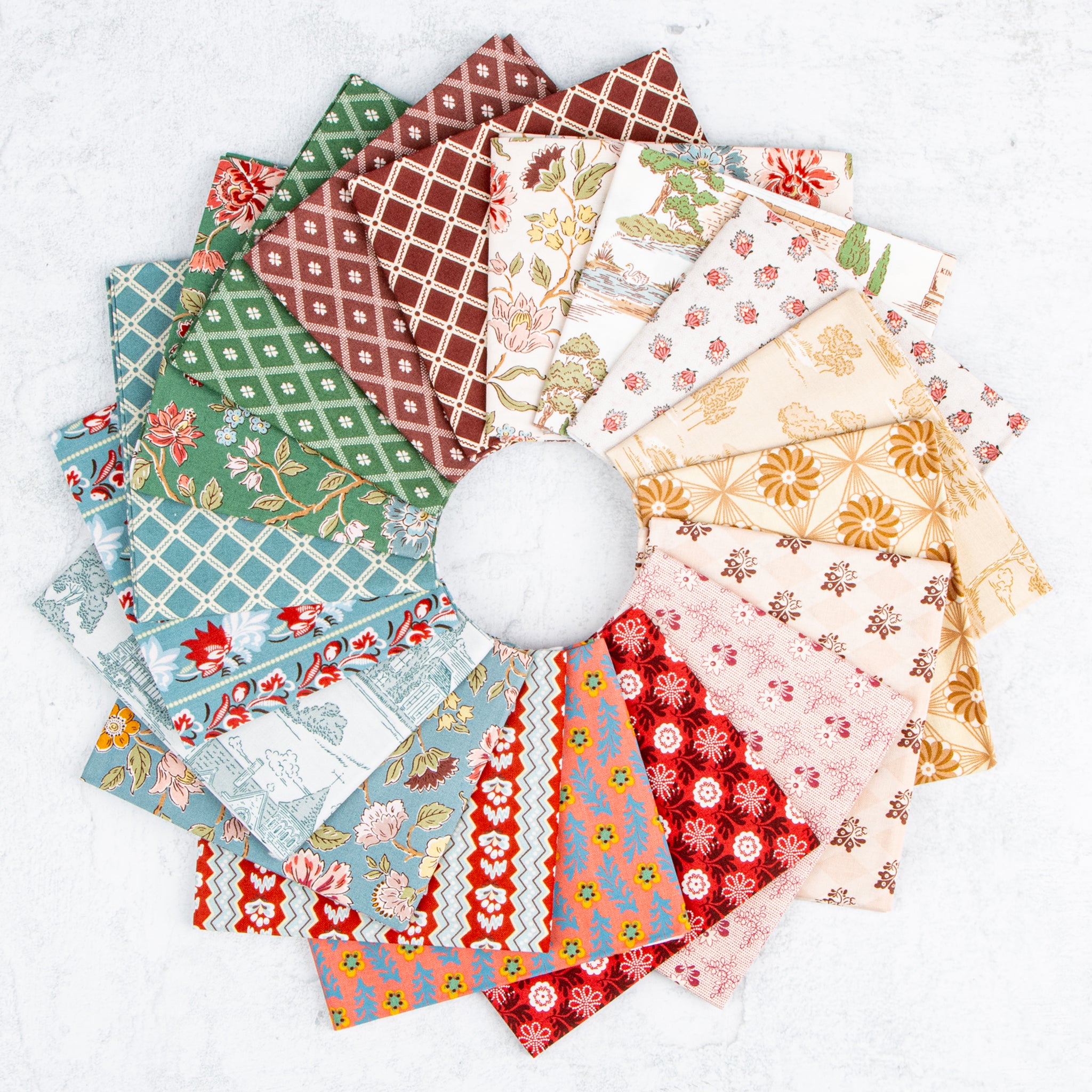 Northanger Abbey fabric collection arranged in a circle with floral, geometric, and scenic prints.
