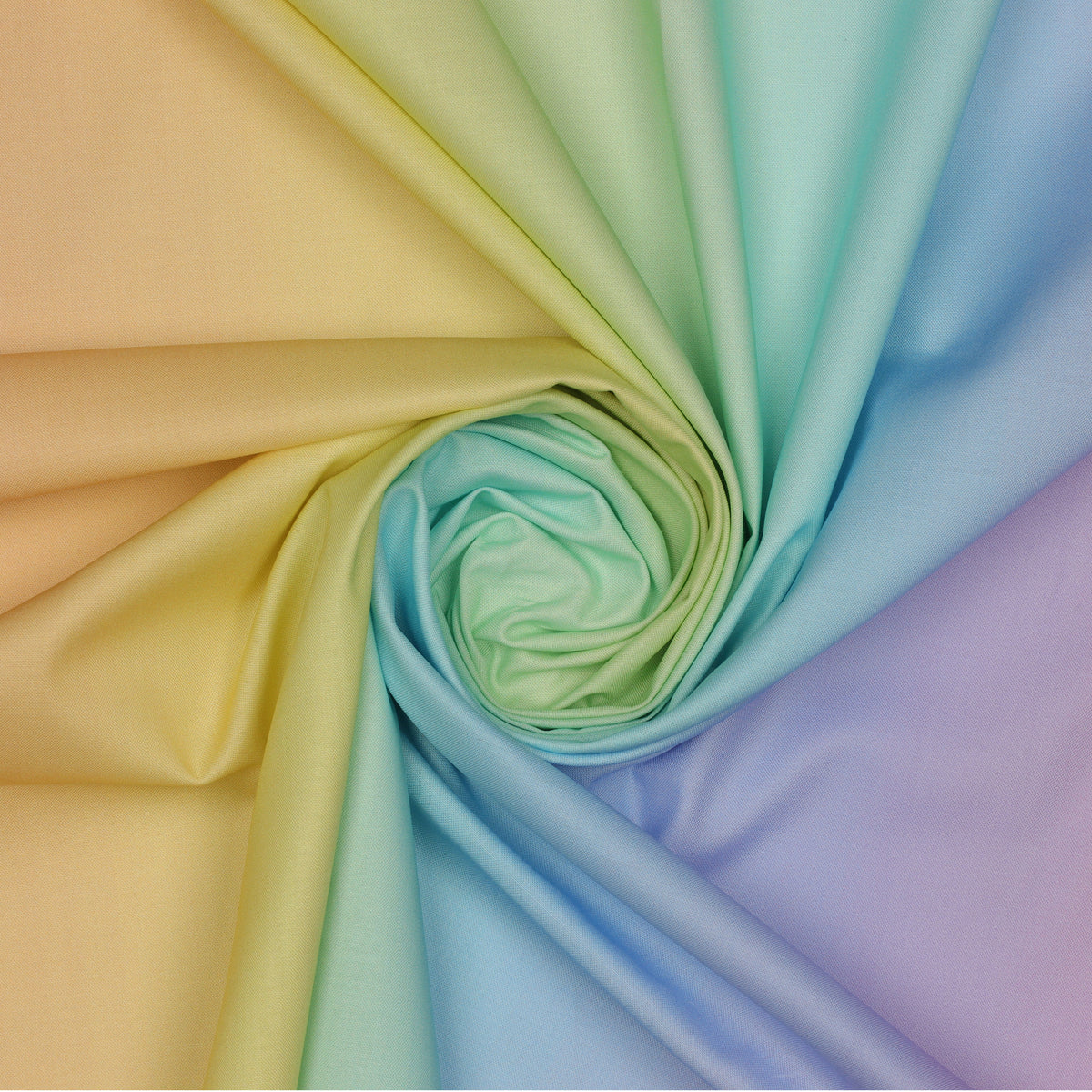 Pastel Rainbow Ombre fabric draped in a spiral with delicate transitions of peach, buttery yellow, mint green, aqua, powder blue, and lavender.