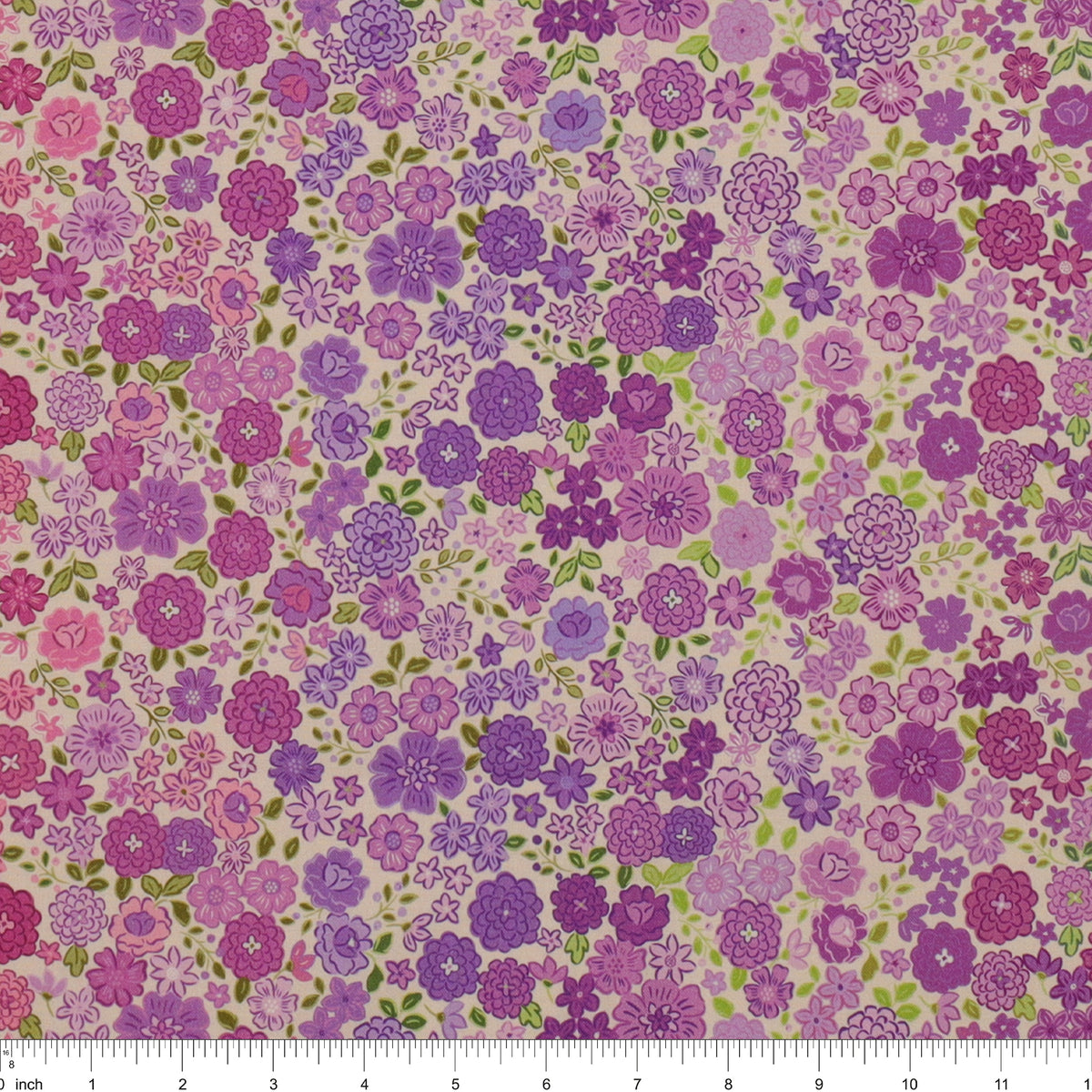 Berry Boho Blooms Ombre fabric with purple and pink flowers and green leaves on a cream background.