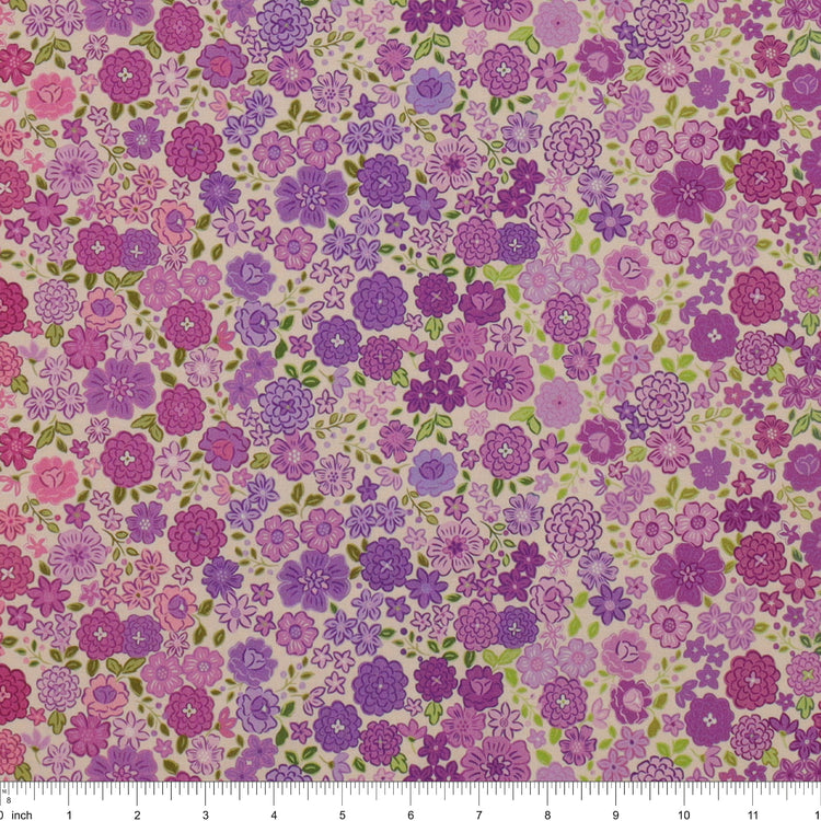 Berry Boho Blooms Ombre fabric with purple and pink flowers and green leaves on a cream background.