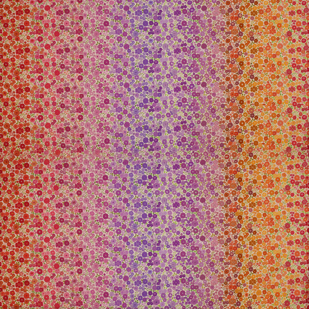 Berry Boho Blooms Ombre fabric with floral colors transitioning from pink and purple to orange and red.