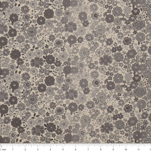 Gray floral fabric with densely scattered flowers in charcoal, taupe, and light gray, shown with a ruler.