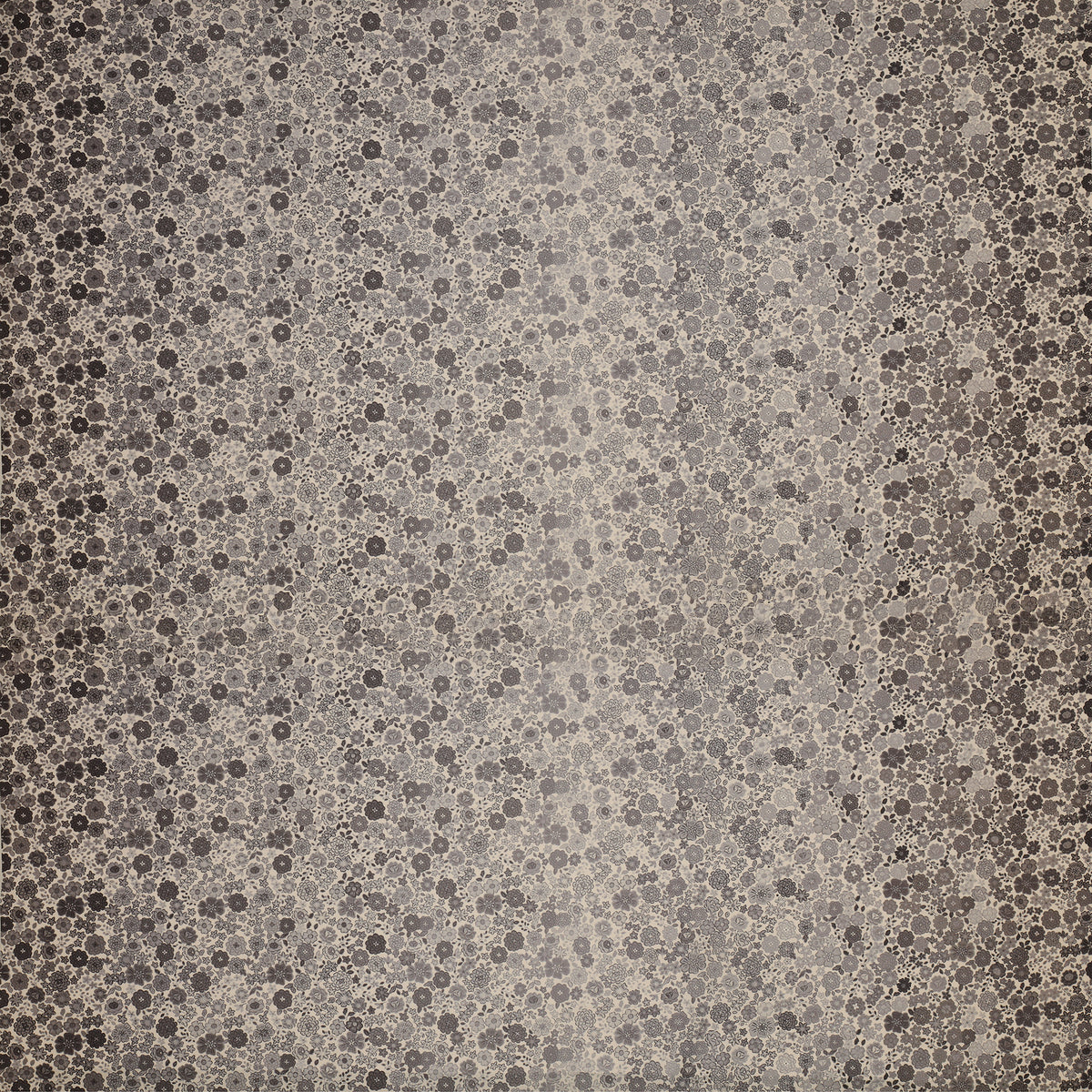 Gray floral ombre fabric with small flowers fading from dark edges to a light gray center.