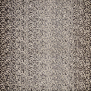 Gray floral ombre fabric with small flowers fading from dark edges to a light gray center.