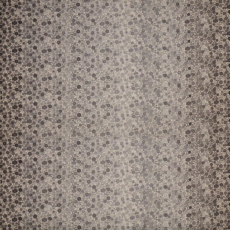 Gray floral ombre fabric with small flowers fading from dark edges to a light gray center.