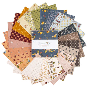 A round stack of quilt fabric squares in assorted patterns and muted colors with a central fabric bundle.