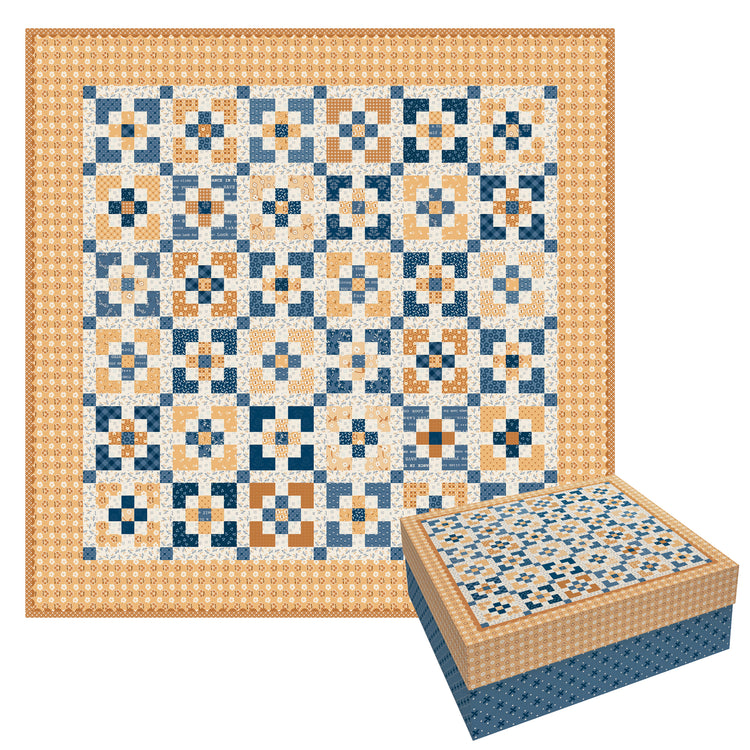 A patchwork quilt with a geometric pattern in navy blue, beige, and orange, shown alongside its matching fabric storage box on a white background.