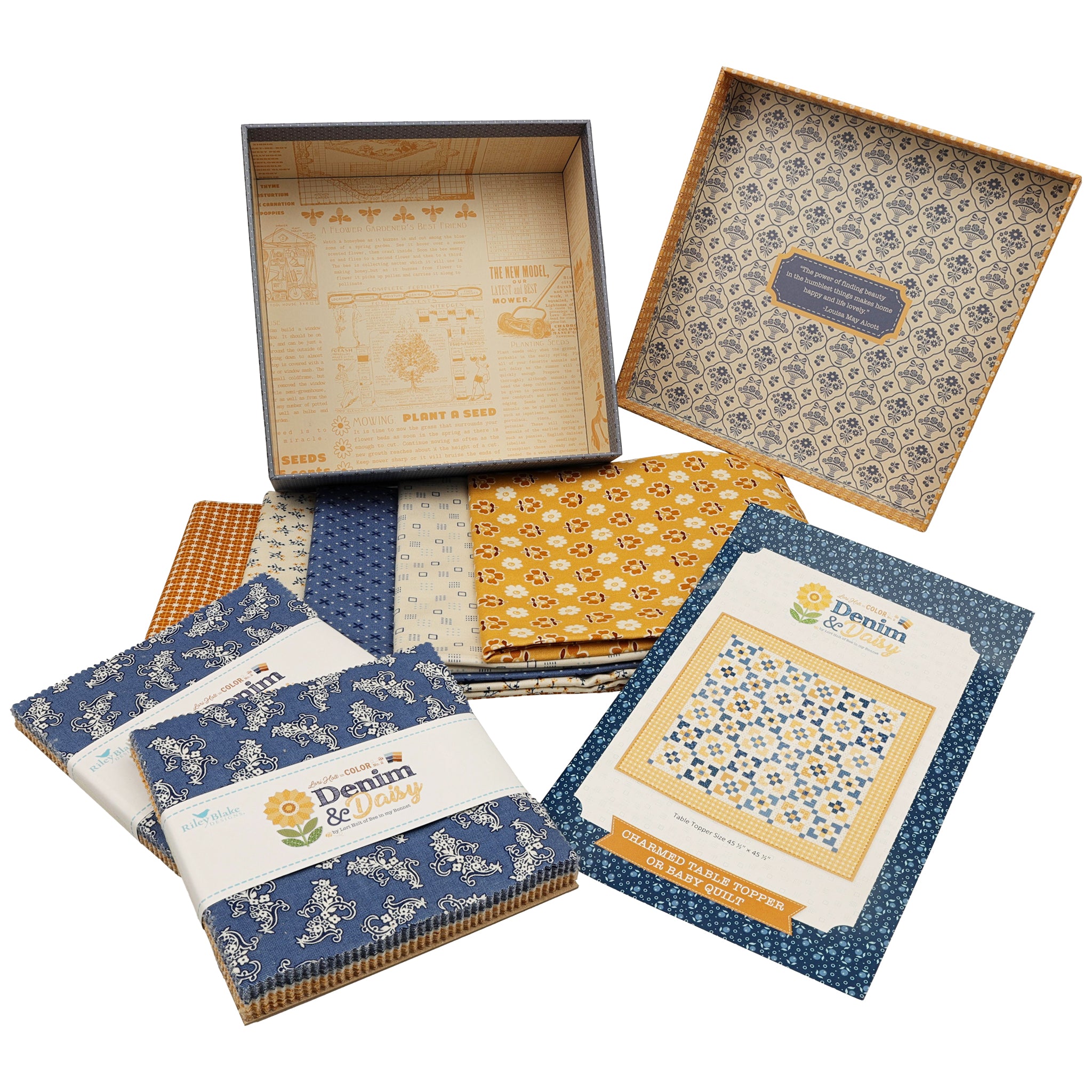 A set of fabric bundles and a patterned gift box. The bundles are wrapped in white paper with blue and gold branding, and the box lid displays a detailed blue and gold geometric pattern.