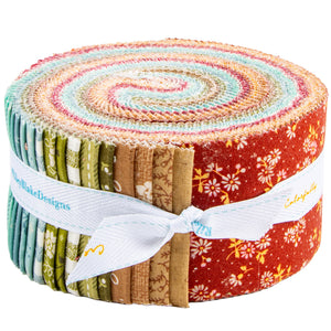 Baked With Love Rolie Polie with colorful precut fabric strips tied in a roll on a white background.