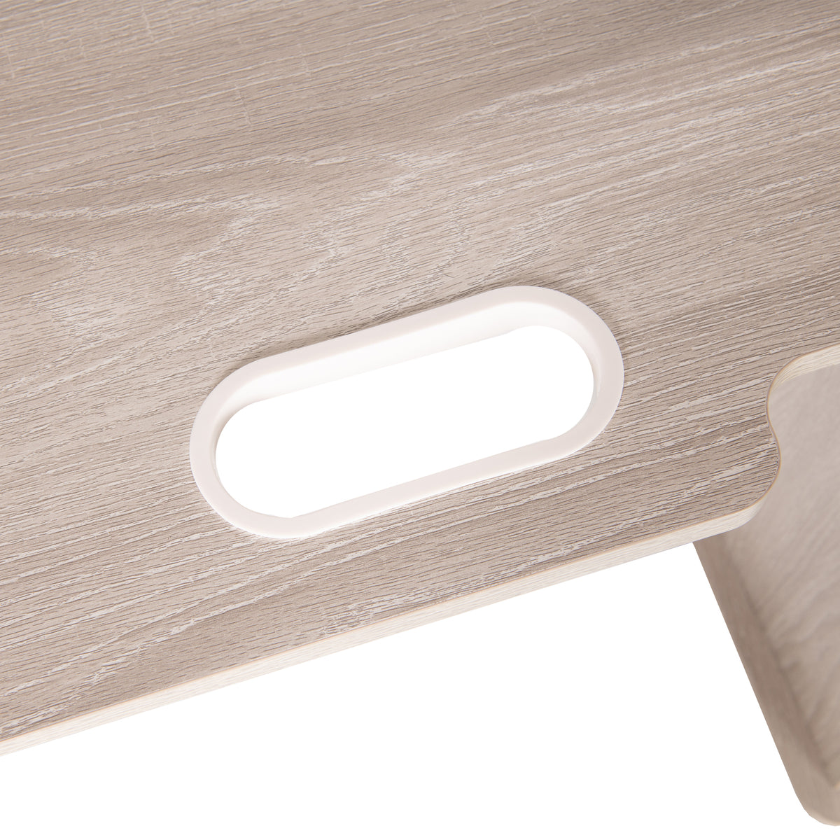 Close-up of oval cutout with white trim in light wood-grain panel of Koala Serger Studio cabinet