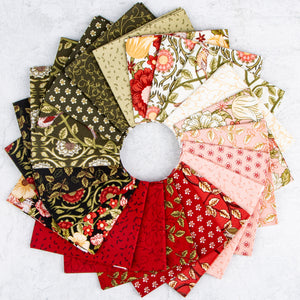 Tangled Garden fabrics with floral, bird, vine, and leaf prints in red, pink, cream, and green.