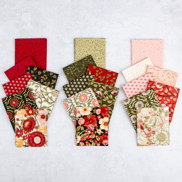 Tangled Garden fabric prints arranged in red, green, cream, pink, and black color groups.