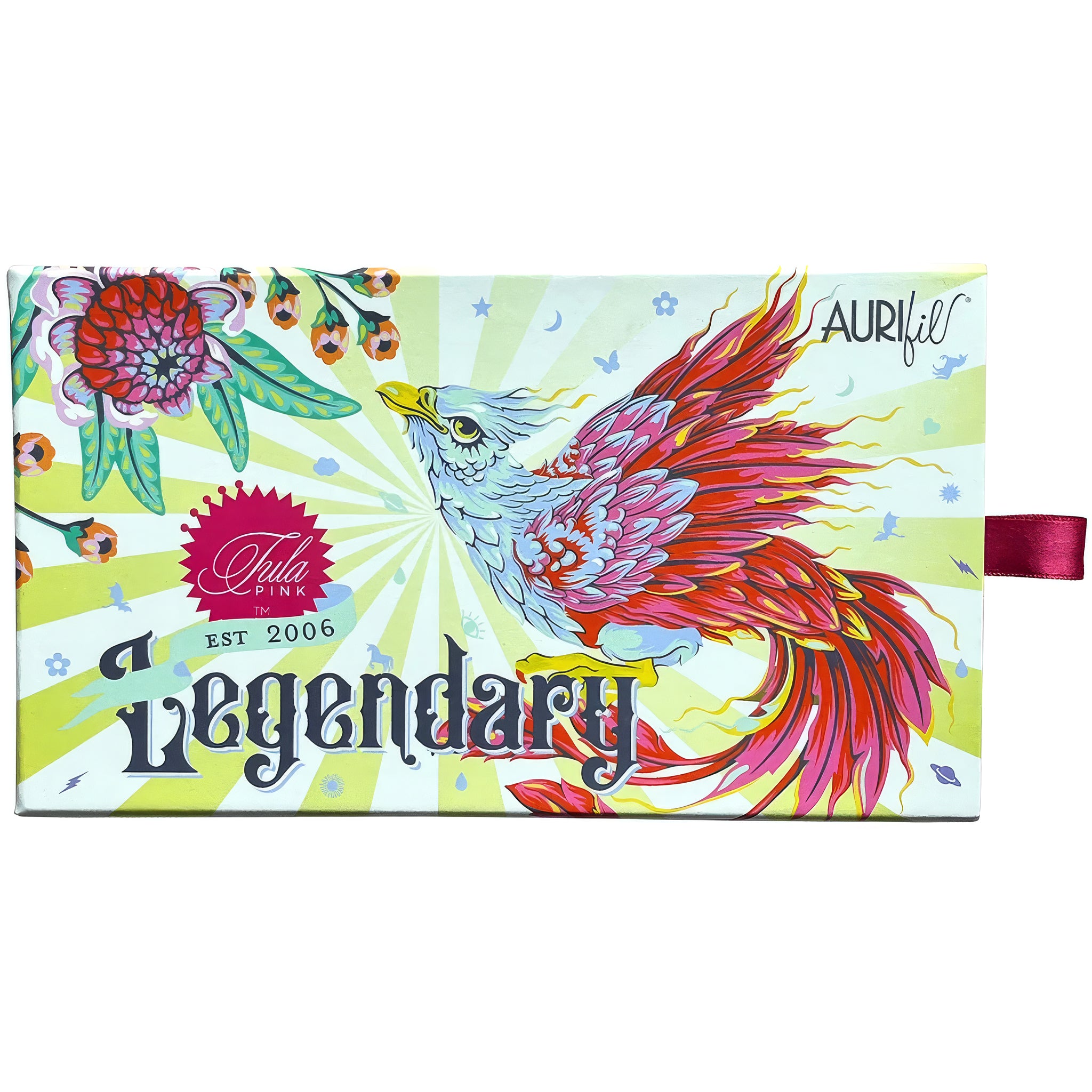 A rectangular illustrated product box for Aurifil Tula Pink 'Legendary', featuring a colorful bird and floral design on a pale yellow-green sunburst background, with a small pink ribbon tag on the right side.